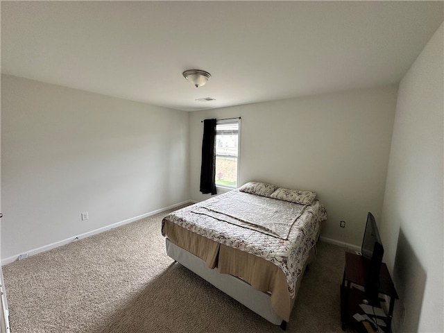 bedroom featuring dark carpet