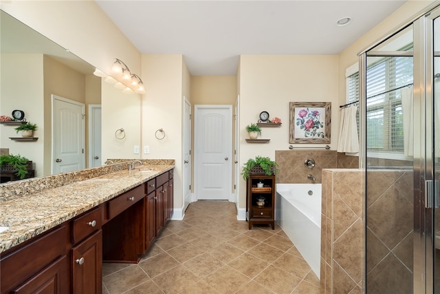 bathroom with independent shower and bath, vanity, and tile patterned flooring