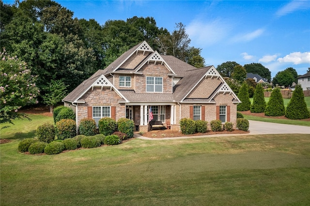 craftsman inspired home with a front yard