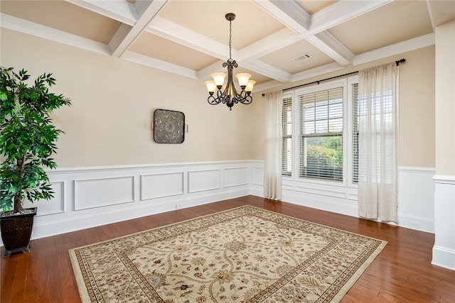 dining area with beam ceiling, coffered ceiling, dark hardwood / wood-style flooring, and a notable chandelier