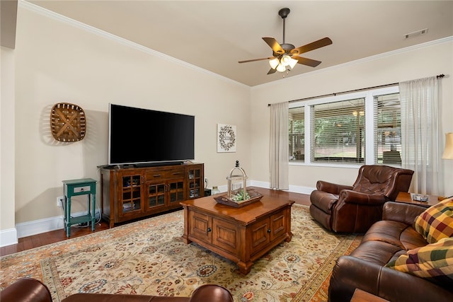 living room featuring ceiling fan, light wood-type flooring, and ornamental molding