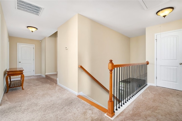 hallway with light colored carpet