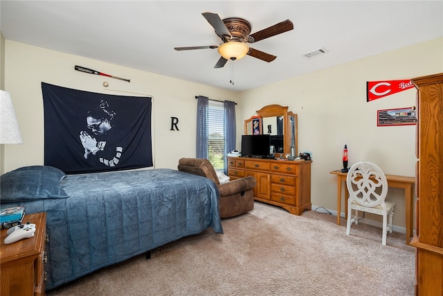 bedroom featuring ceiling fan and light colored carpet