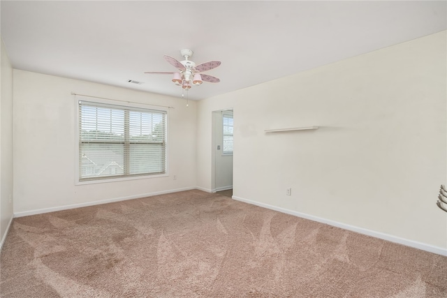 spare room with carpet and ceiling fan