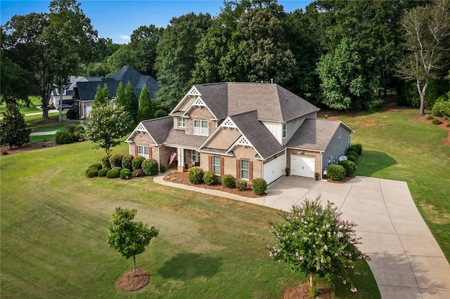 view of front of property with a garage and a front lawn