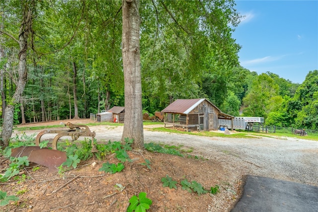 view of front of home with an outdoor structure