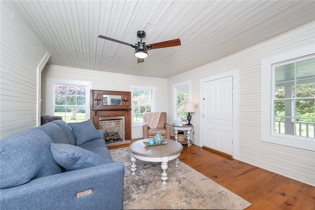 living room with ceiling fan, wooden ceiling, and hardwood / wood-style floors