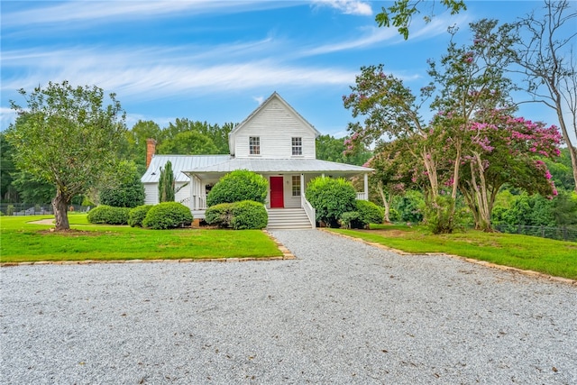 view of front of home featuring a front lawn and a porch