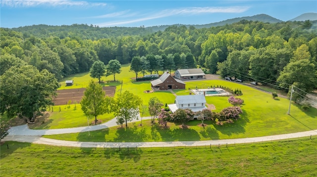 birds eye view of property with a mountain view and a rural view