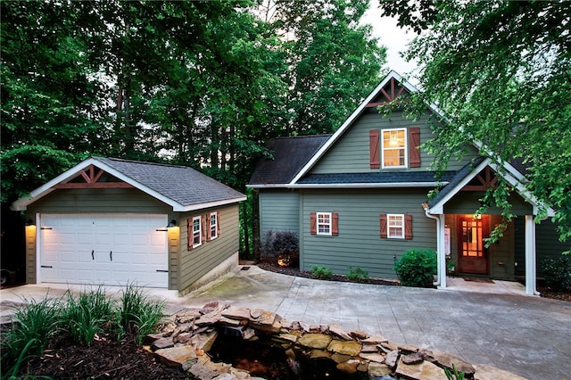 craftsman house with an outbuilding and a garage