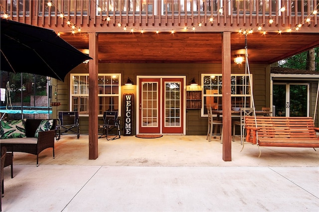 view of patio featuring french doors and a trampoline