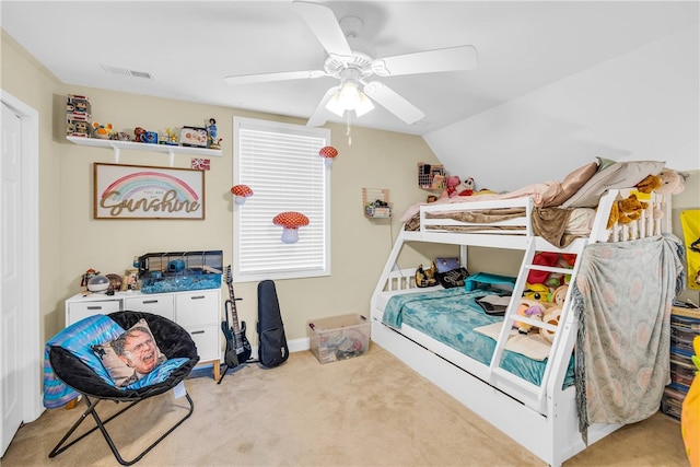 bedroom with vaulted ceiling, light carpet, and ceiling fan