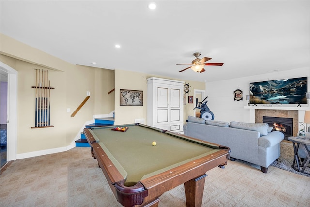 recreation room with ceiling fan, light colored carpet, billiards, and a tile fireplace