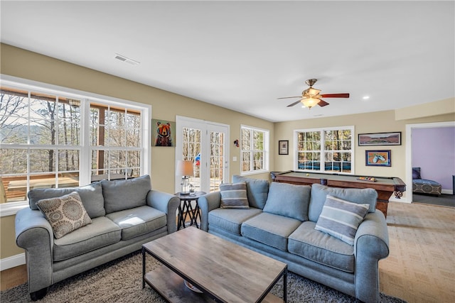 living room featuring pool table, ceiling fan, and plenty of natural light