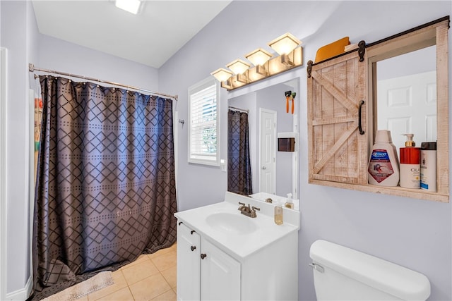 bathroom featuring a shower with shower curtain, tile patterned floors, vanity, and toilet