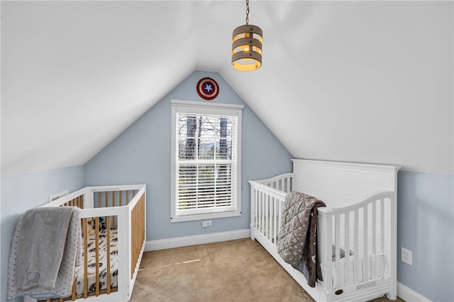 bedroom with light carpet, vaulted ceiling, a nursery area, and a chandelier