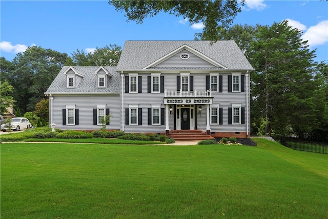 colonial home with a front yard