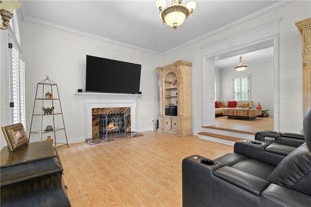 living room featuring a fireplace, ornamental molding, and hardwood / wood-style flooring