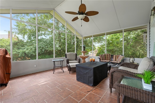 sunroom / solarium featuring ceiling fan and lofted ceiling