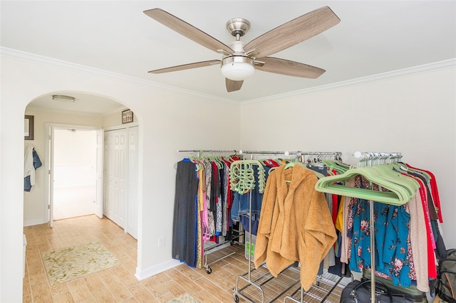 walk in closet featuring hardwood / wood-style flooring and ceiling fan