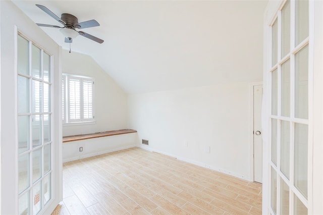 additional living space with light wood-type flooring, vaulted ceiling, and ceiling fan