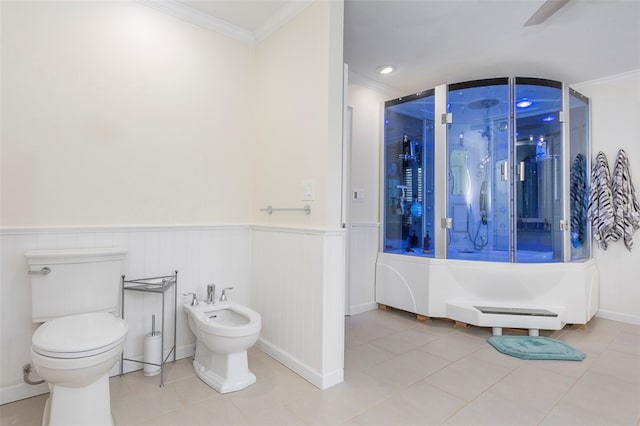 bathroom featuring tile patterned floors, toilet, and a bidet