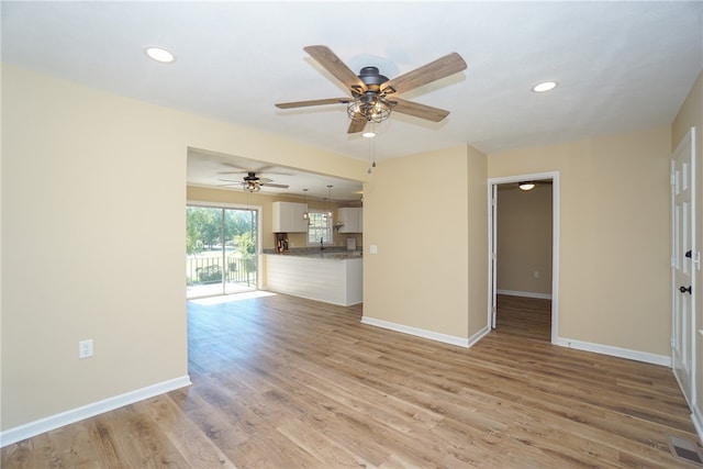 606 N Catherine St, Walhalla, SC 29691 - unfurnished living room featuring ceiling fan, light wood-type flooring, and recessed lighting