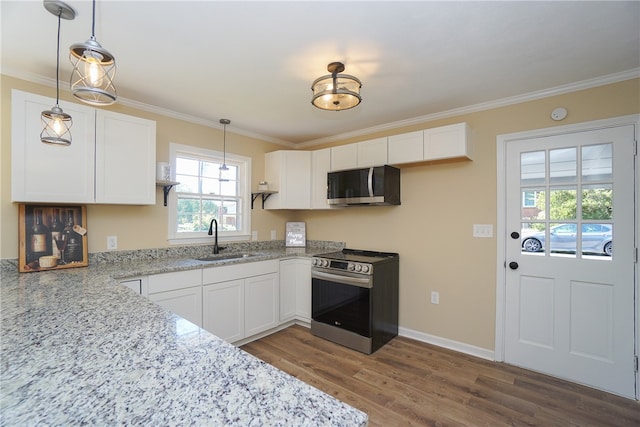 606 N Catherine St, Walhalla, SC 29691 - kitchen featuring stainless steel appliances, ornamental molding, white cabinets, light stone countertops, and dark wood finished floors