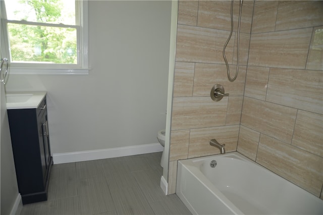 full bathroom with vanity, toilet, tile patterned floors, and tiled shower / bath