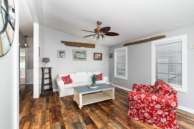 living room featuring ceiling fan, vaulted ceiling, and dark hardwood / wood-style flooring