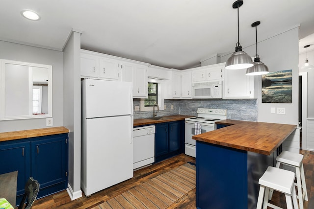 kitchen with white cabinets, white appliances, a breakfast bar area, blue cabinetry, and wood counters