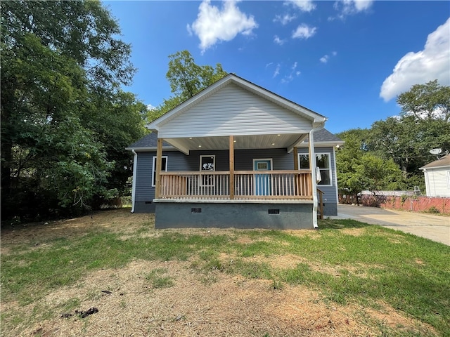 bungalow with a front yard