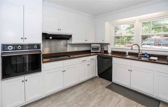 kitchen featuring ornamental molding, black appliances, white cabinetry, and sink