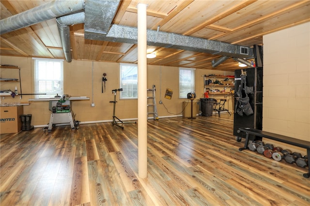 basement with hardwood / wood-style flooring and wood ceiling