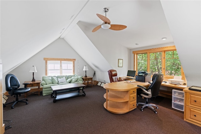 home office featuring dark colored carpet, vaulted ceiling, and ceiling fan