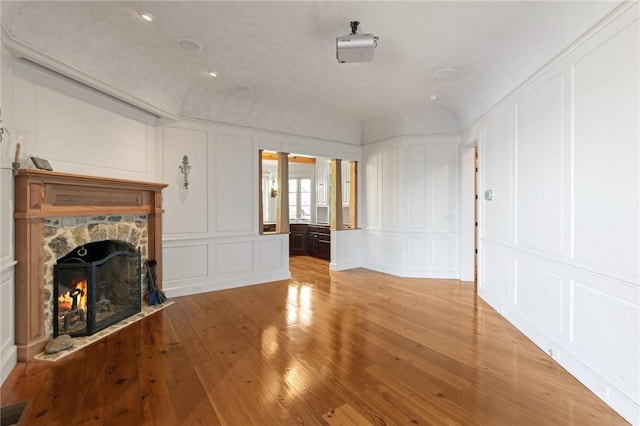 unfurnished living room with light hardwood / wood-style floors and a fireplace