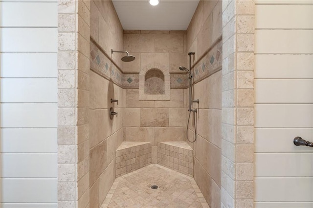 bathroom featuring tiled shower