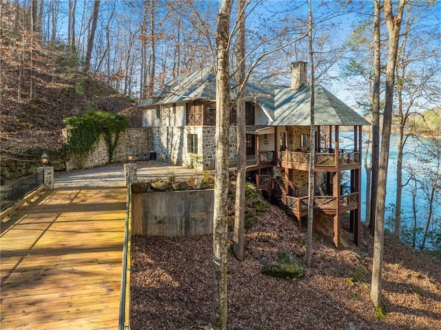 view of front of house with a water view