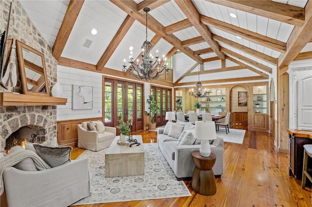 604 Top Ridge Dr, Sunset, SC 29685 - living area with beam ceiling, light wood-type flooring, visible vents, an inviting chandelier, and a fireplace