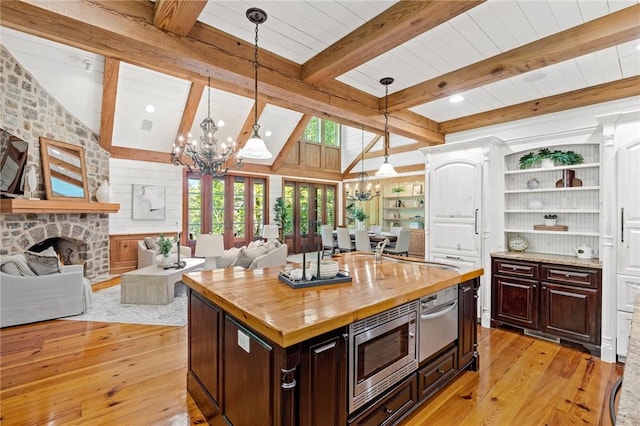 604 Top Ridge Dr, Sunset, SC 29685 - kitchen featuring butcher block counters, open floor plan, an inviting chandelier, and stainless steel microwave