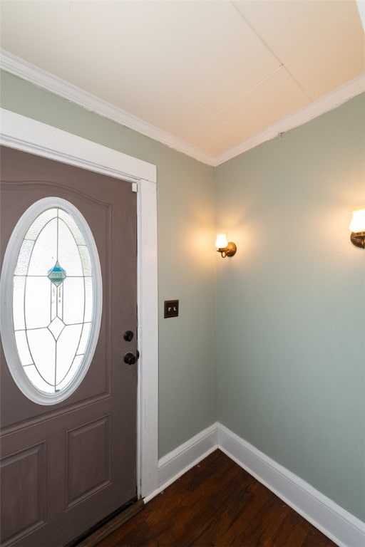 entrance foyer featuring dark hardwood / wood-style floors and crown molding