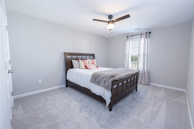 bedroom featuring light carpet and ceiling fan