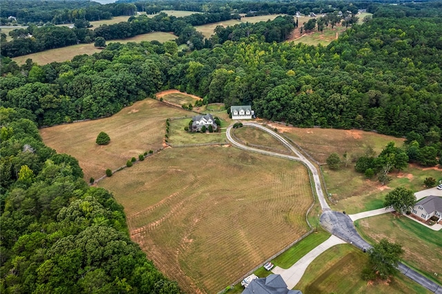 birds eye view of property with a rural view