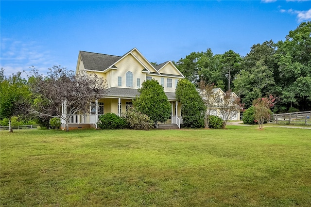 view of front facade with a front yard and a porch