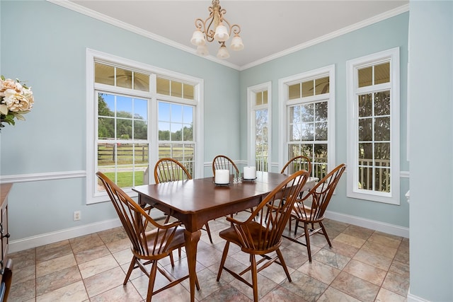 dining room with a chandelier and crown molding