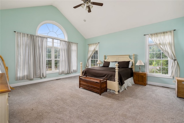 carpeted bedroom featuring ceiling fan and high vaulted ceiling