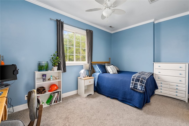 carpeted bedroom featuring crown molding and ceiling fan