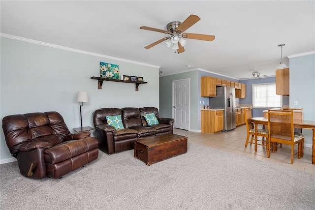 tiled living room featuring ornamental molding and ceiling fan