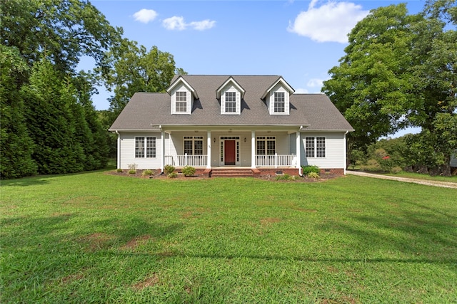 cape cod-style house with covered porch and a front yard