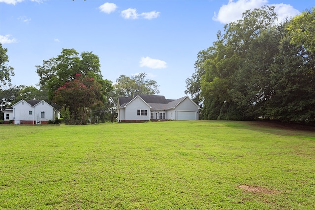 view of yard featuring a garage